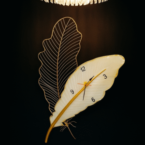 Handcrafted metal wall clock in dual leaf design with golden accents and modern minimalist styling – large decorative wall clock for living room and hallway – Everaura”